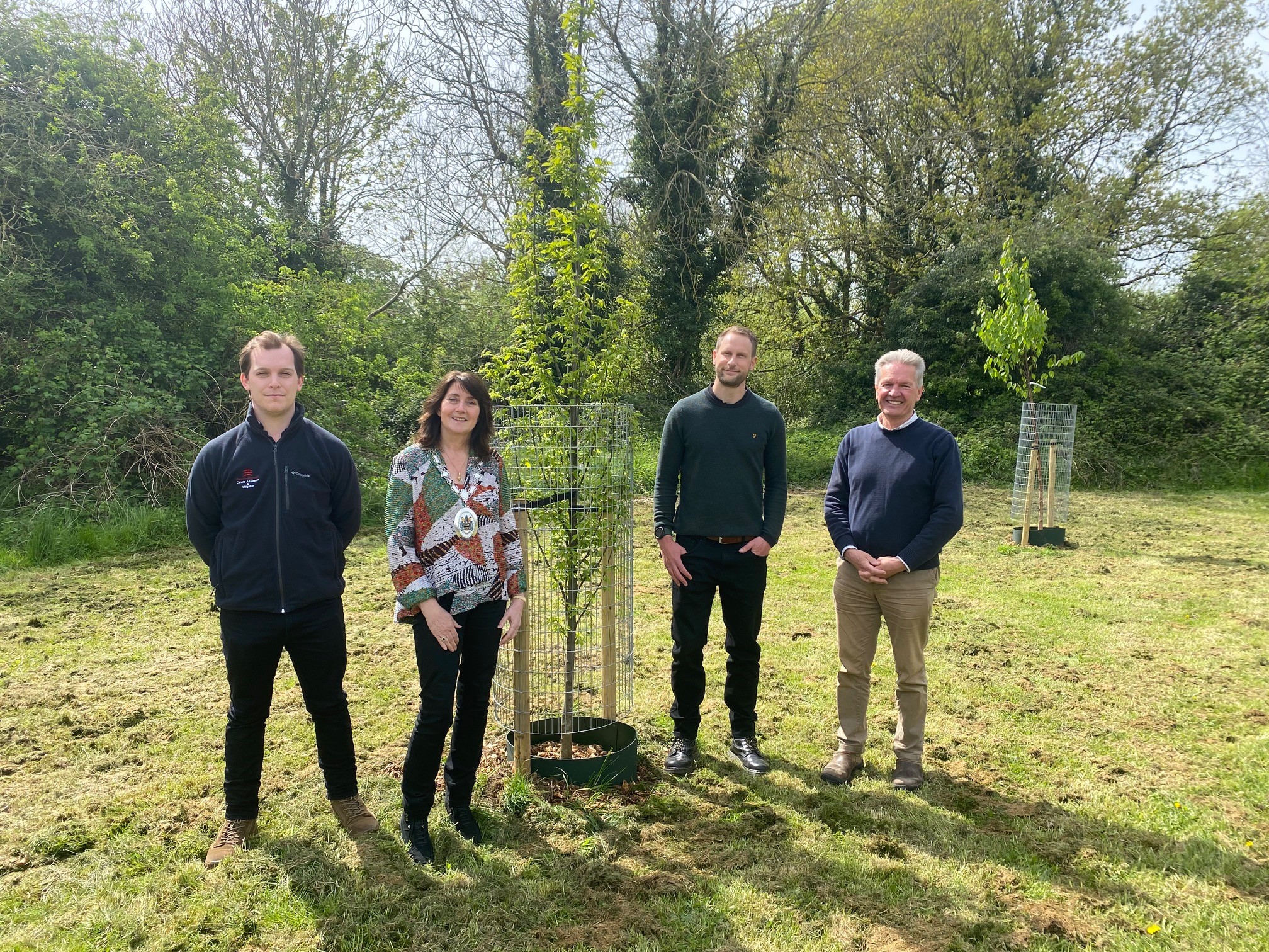 Councillors Diana Garrod and Peter Schwier are joined by Braintree District Council officer Andrew Digby and Essex County Council officer George Bartley in front of newly planted trees at Bradford Meadows green space in Braintree.