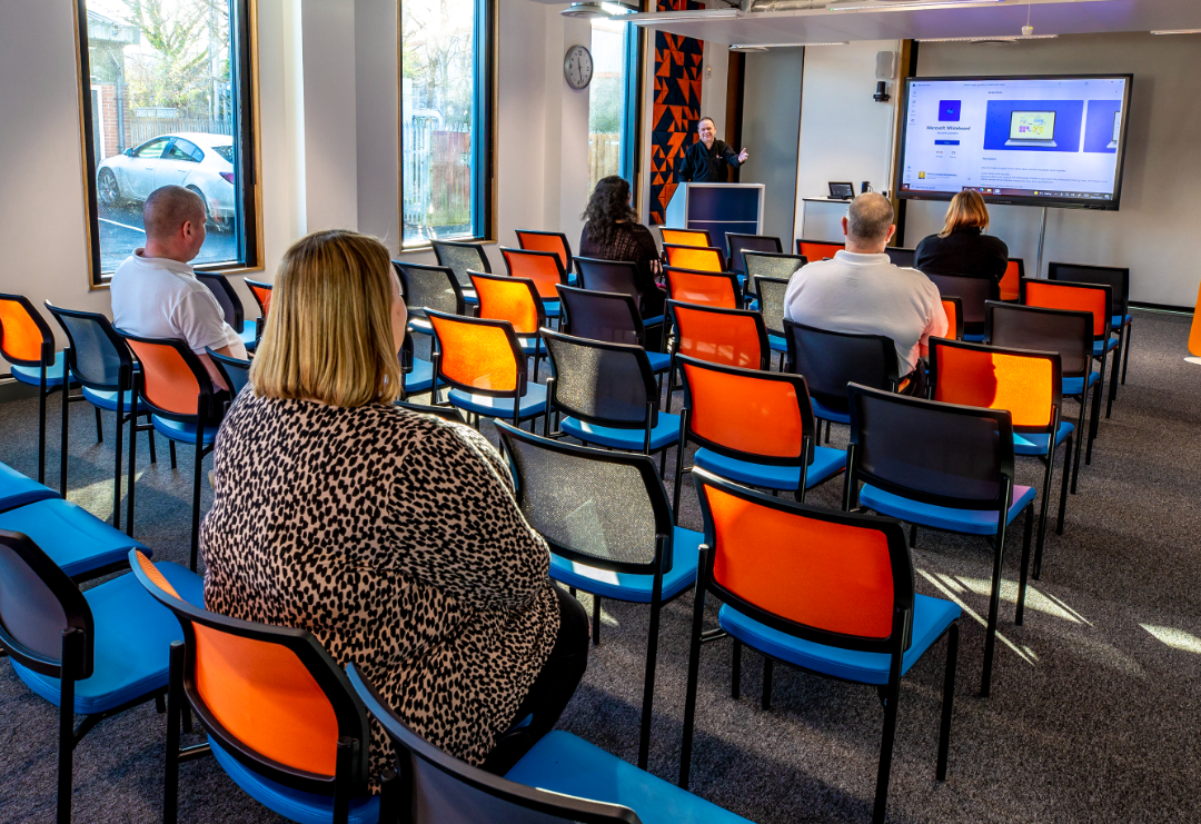 Full conference room with people