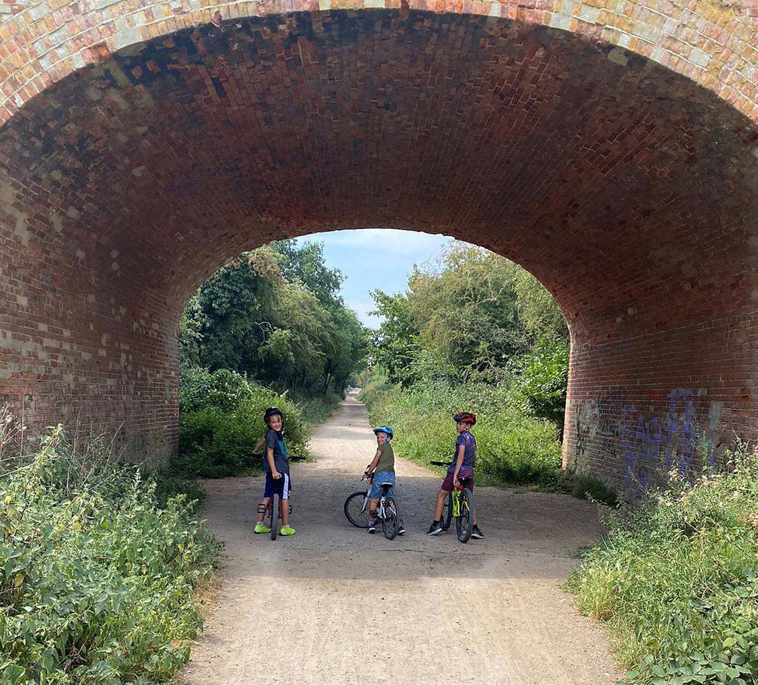 Three boys cycling along Flitch Way