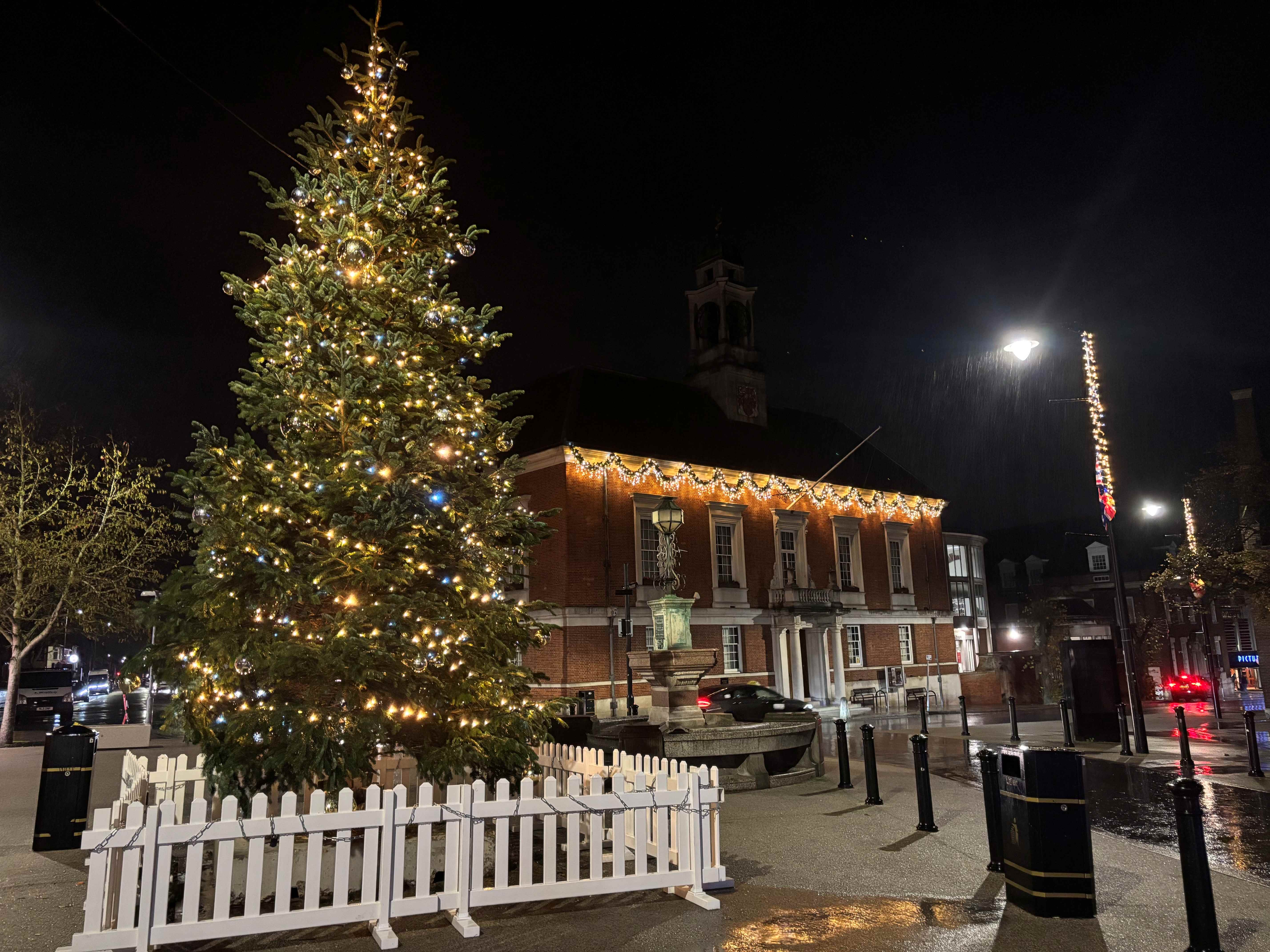The image shows a decorated Christmas tree with the Braintree town hall pictured to the right at the back of the image