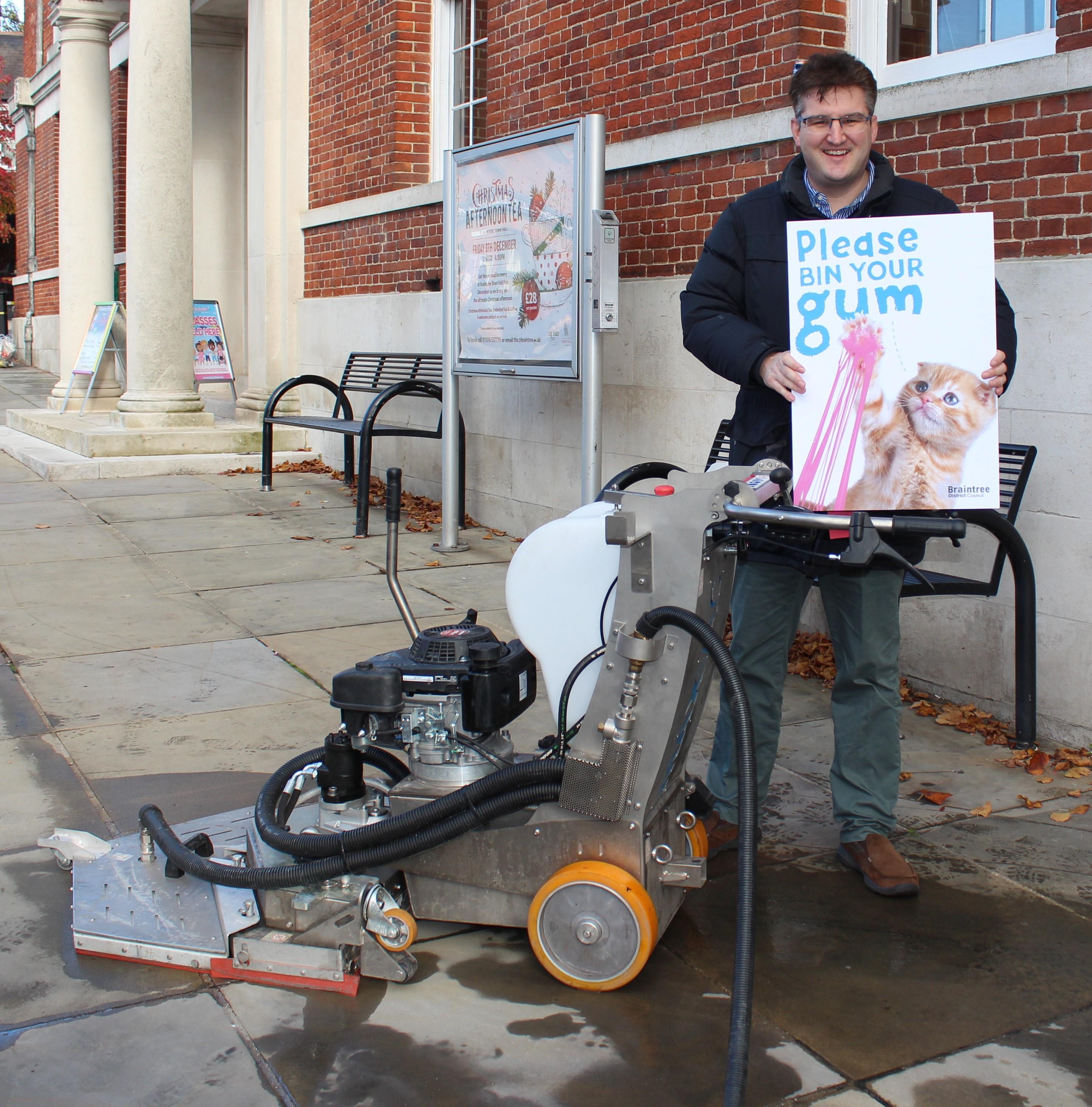 Cllr Tom Cunningham with gladiator gum machine and campaign bin your gum in town centre