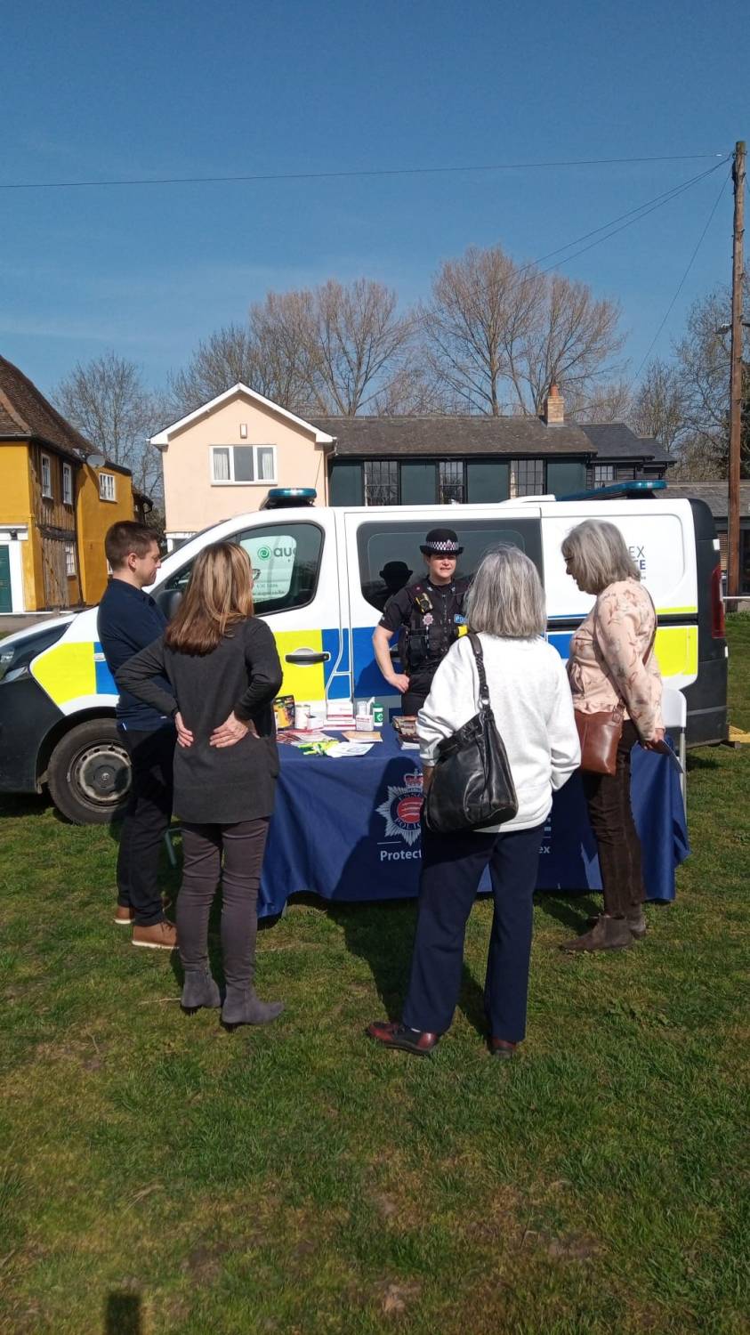 Photo of people talking to a police officer