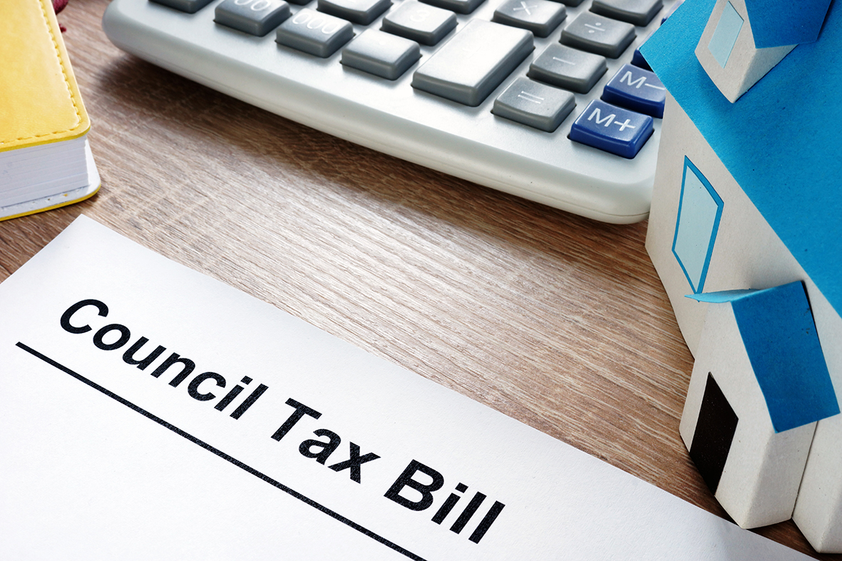 image of a computer keyboard and a piece of paper saying council tax bill
