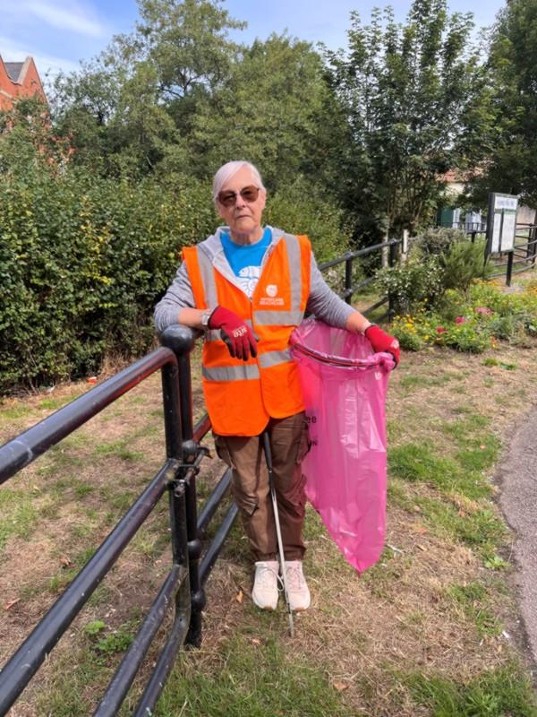 Eileen wearing high visibility clothing during a litter pick for the Halstead RiverCare Group
