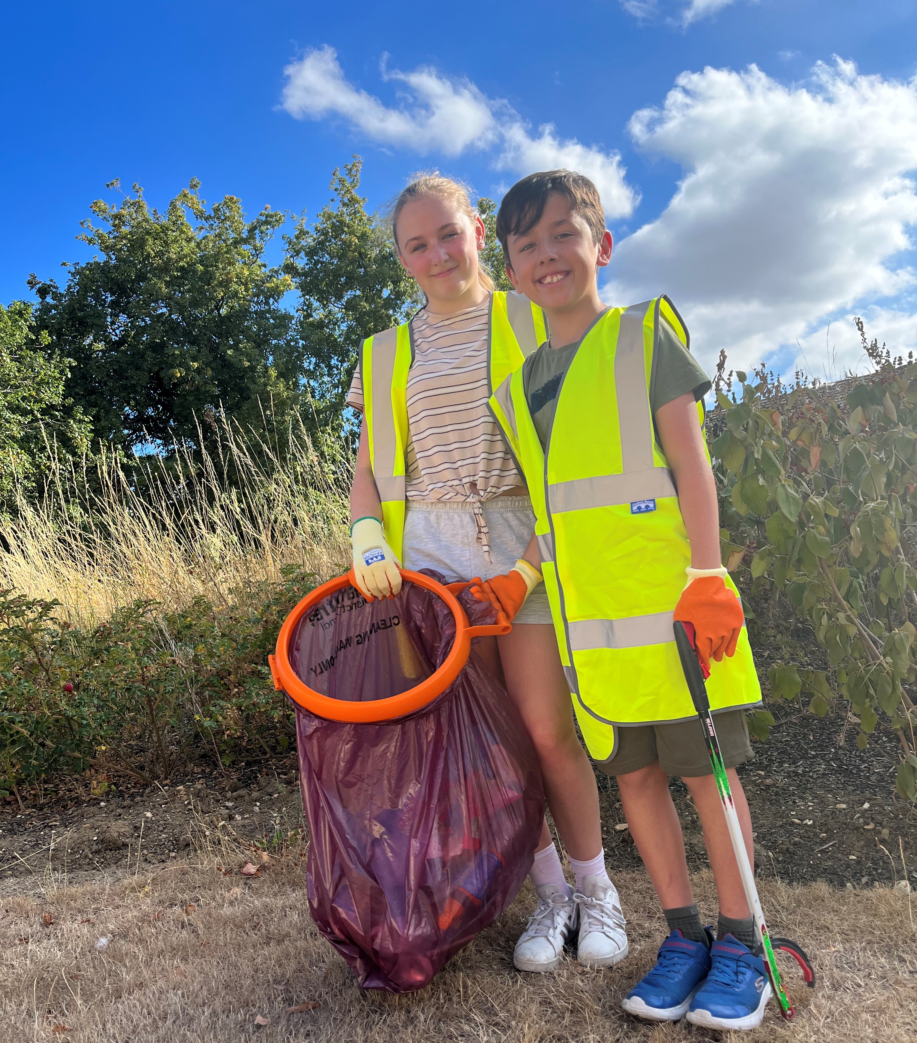 Grace and Jamie litter picking the Rivenhall Park estate in Witham