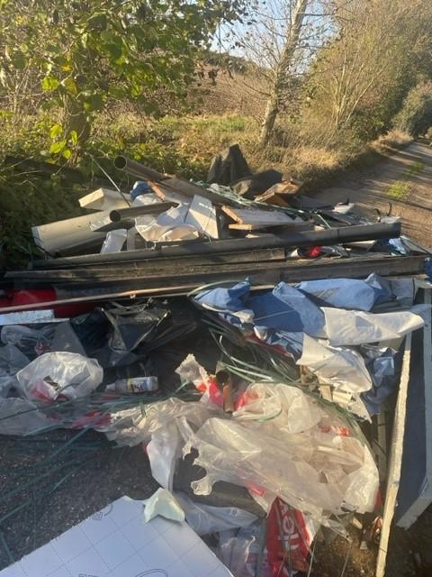 image shows fly tip blocking howbridge hall road witham