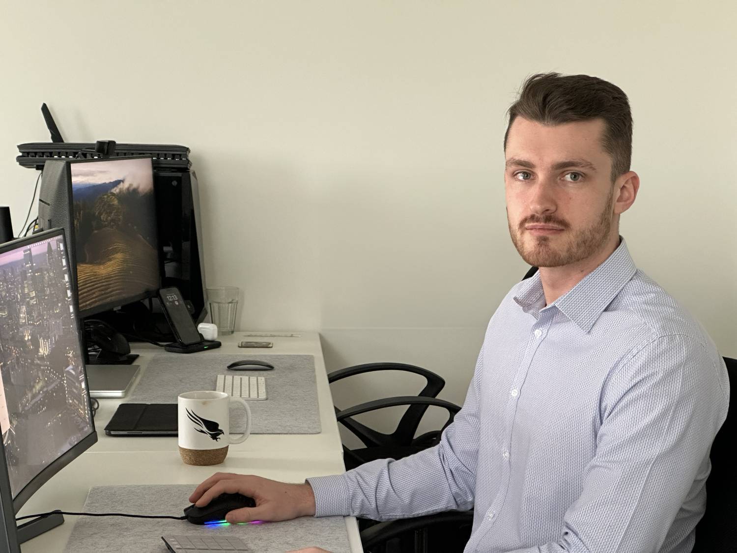 Jake Murray sitting next to a computer screen