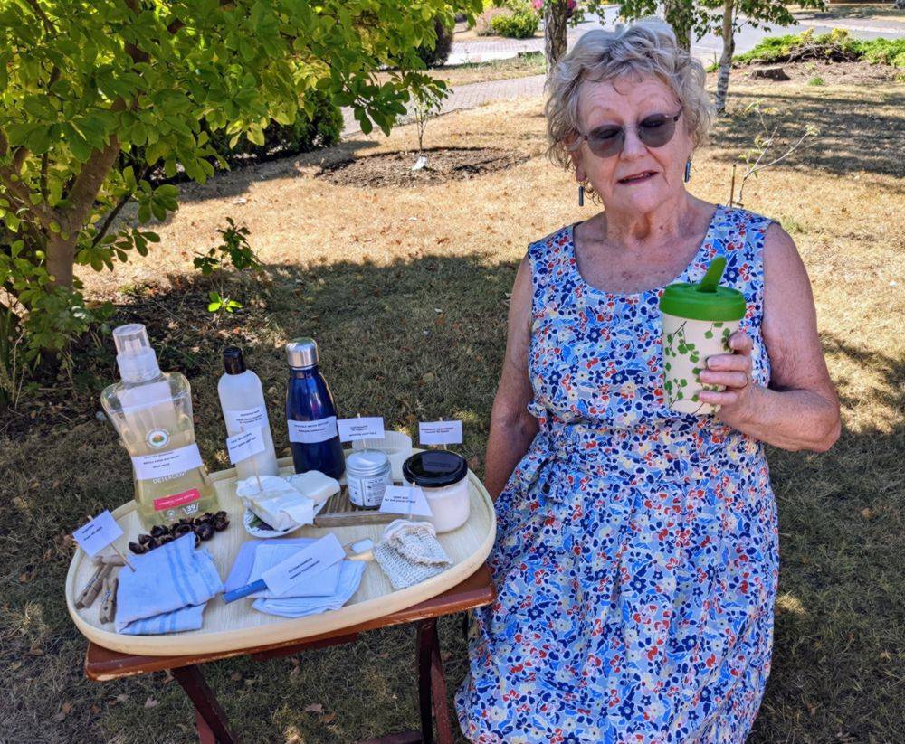 Photo of Jenny Jemison showcasing some of the products used for cleaning 