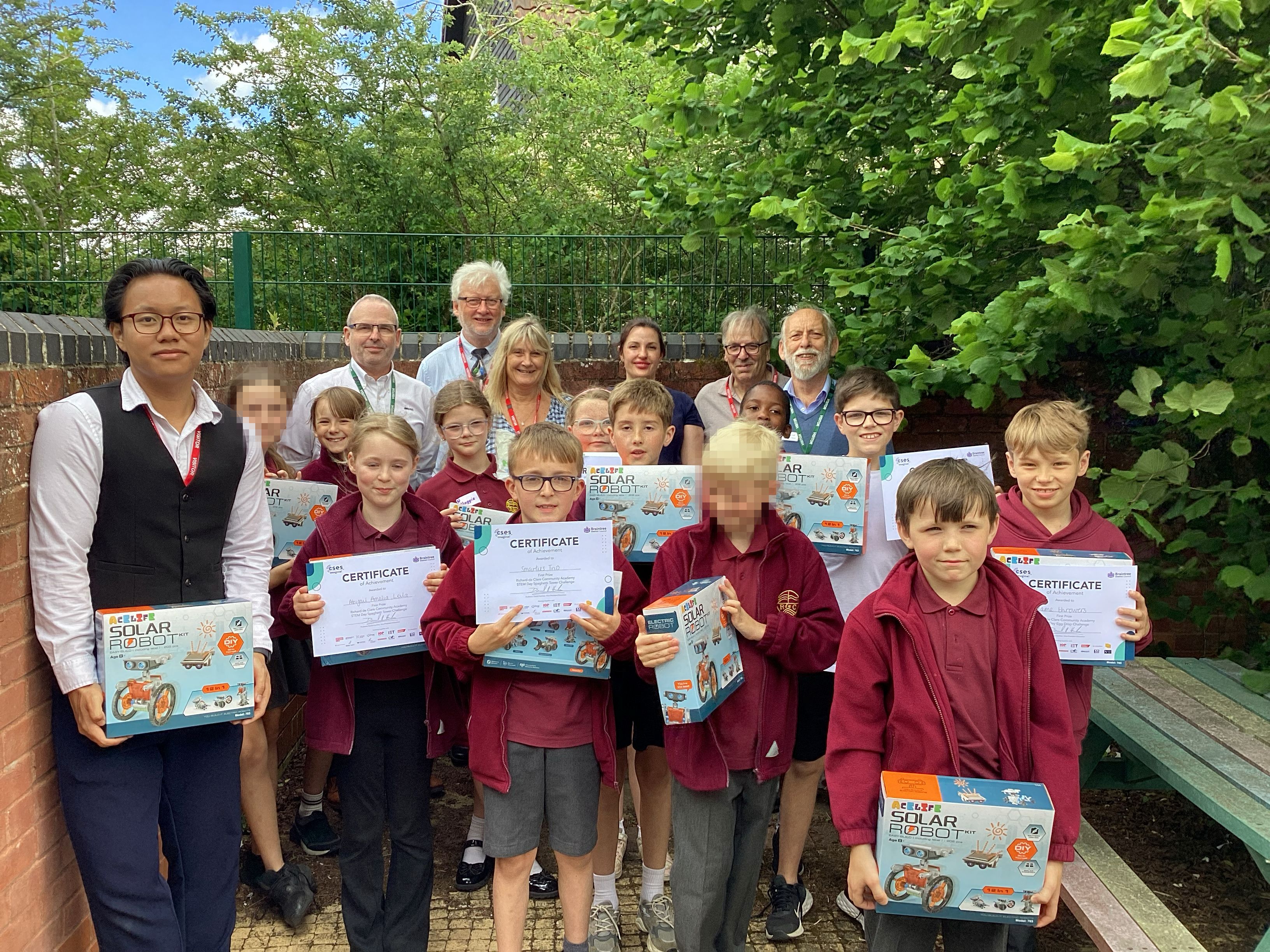 Winners at Richard de Clare Community Academy receiving their certificates and prizes together with STEM volunteers and a representative from Braintree District Council.