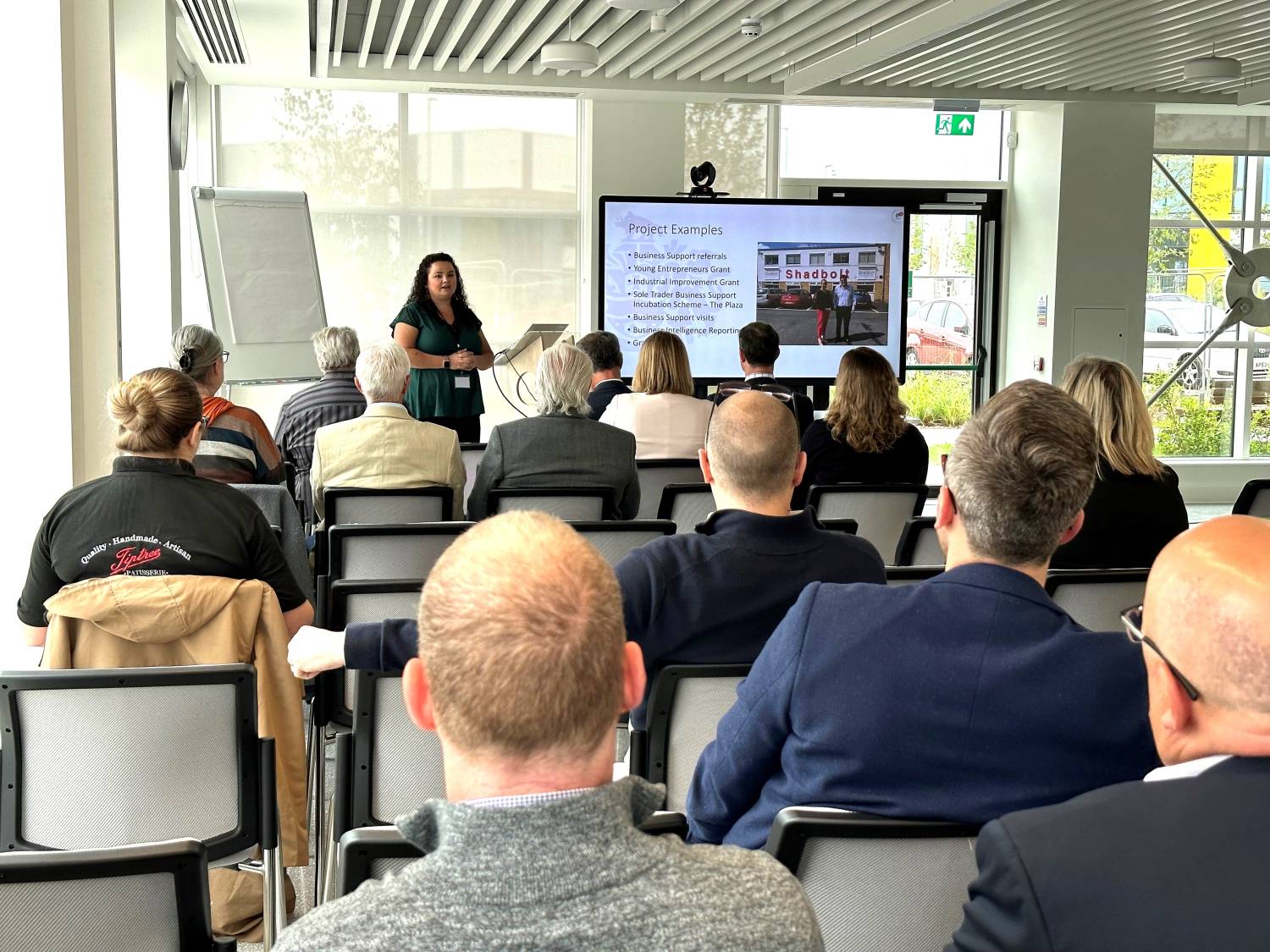 A representative giving a presentation to an audience