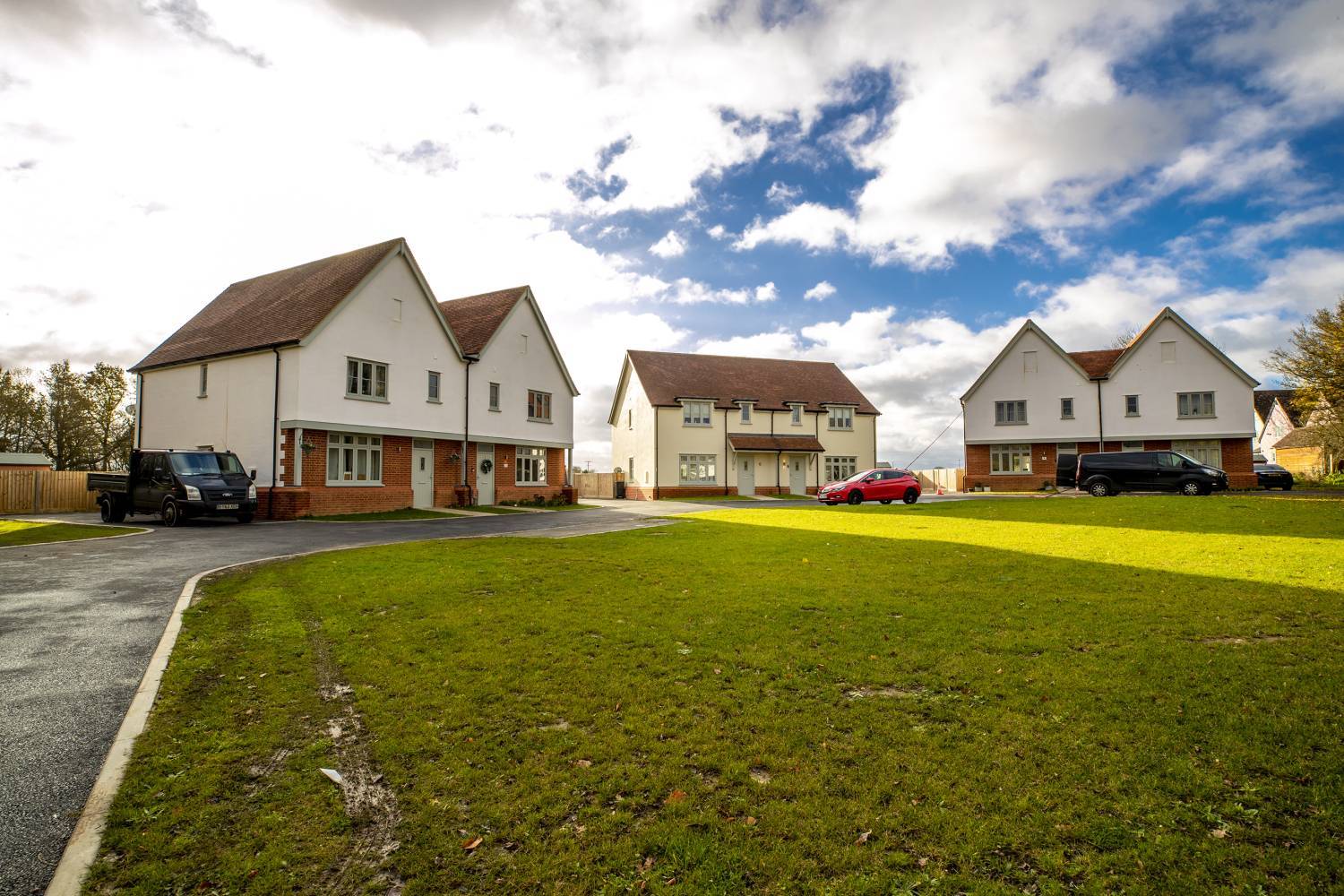 Shalford modern housing with houses and field - Image