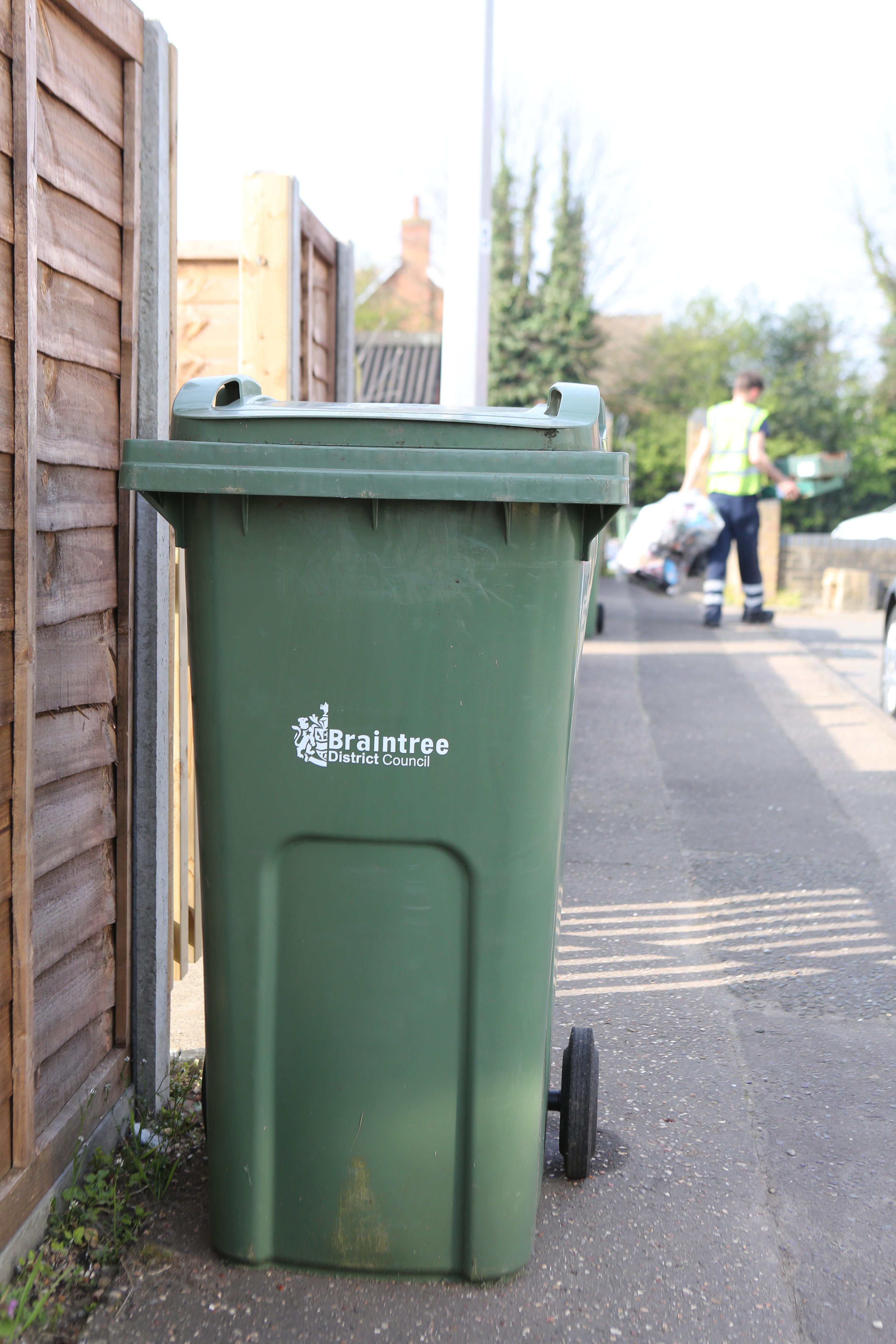 image shows green bin presented ready for collection of garden waste