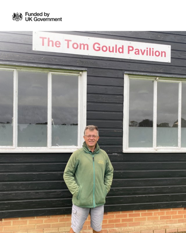 Braintree Cricket Club solar panel installation - man standing outside of club building