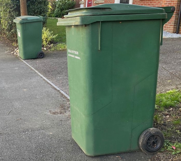 image shows garden waste bins at kerbside