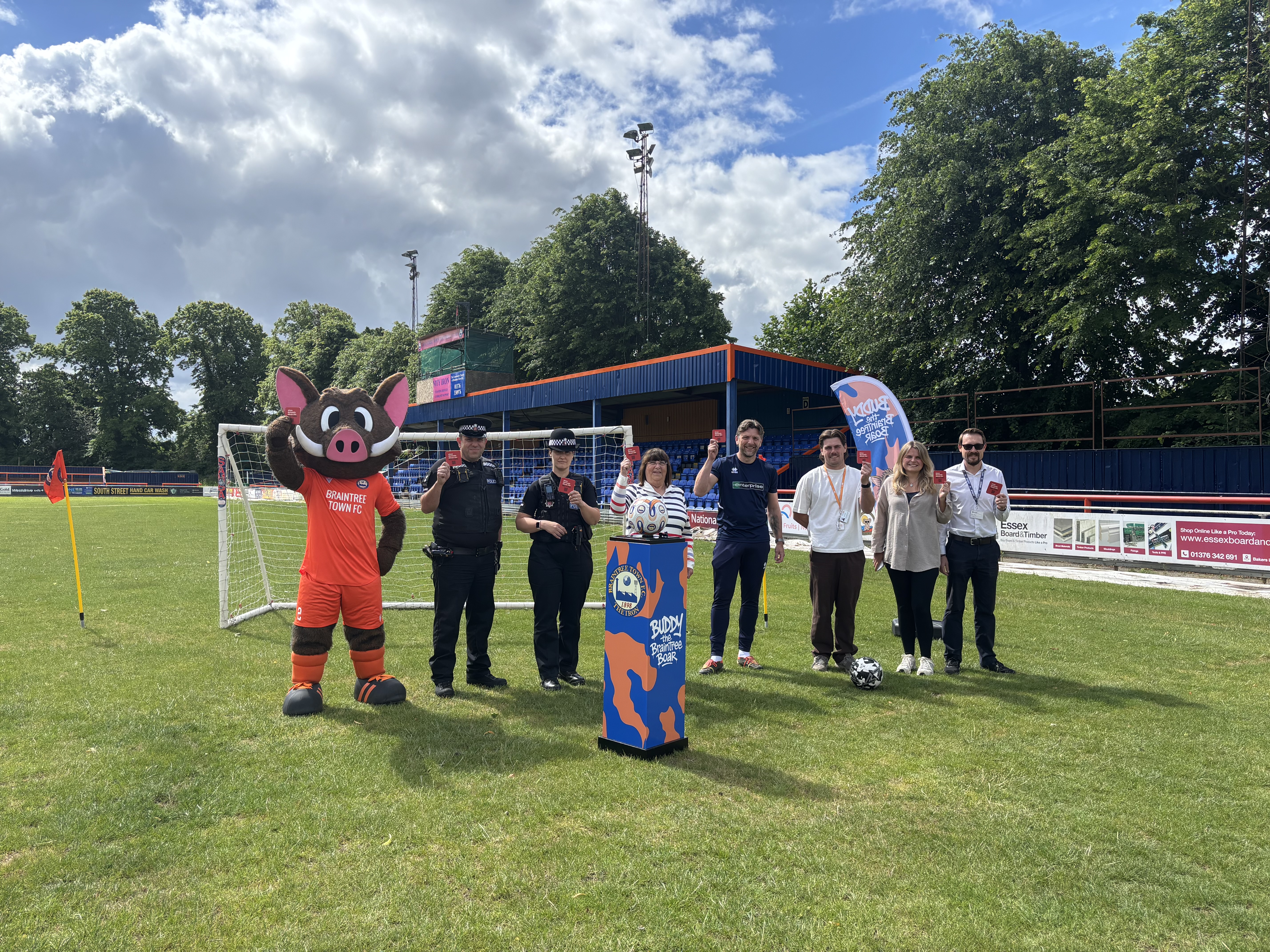 Braintree District Council officers, Cllr Lynette Bowers-Flint, Essex Police, Eastlight Community Homes, Buddy the Boar and Braintree Town Football Club launch the campaign at the Rare Breed Meat Co. Stadium.