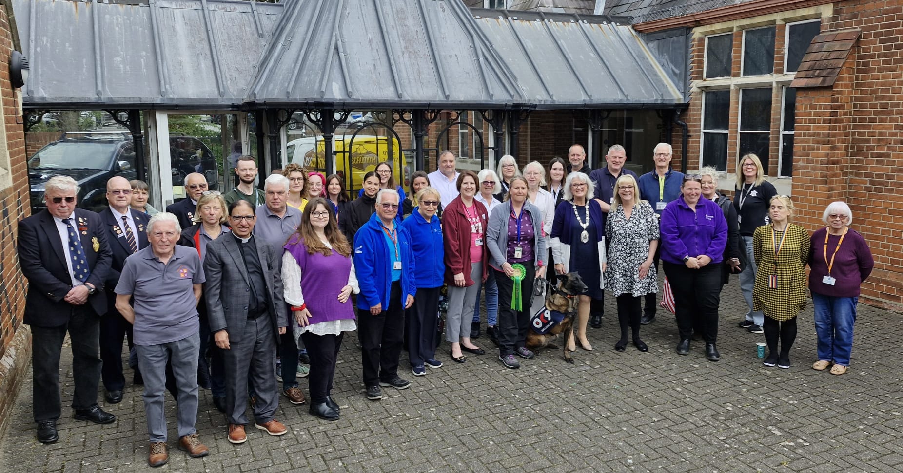 Group photo of exhibitors at community showcase.