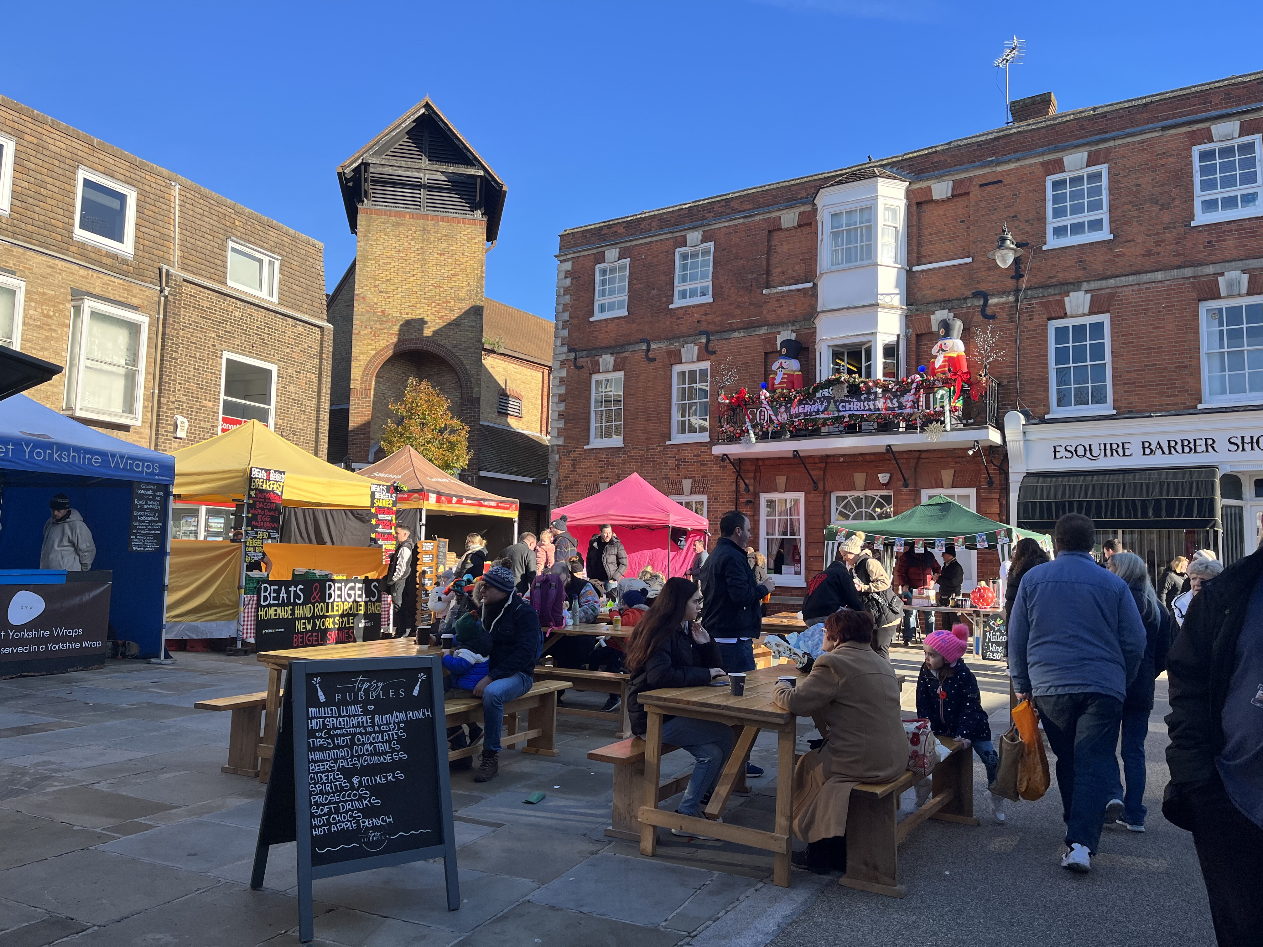 Visitors enjoy food from street food vendors.
