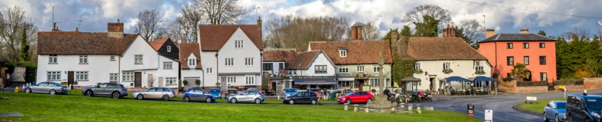 landscape photo of street with cars parked in Finchingfield