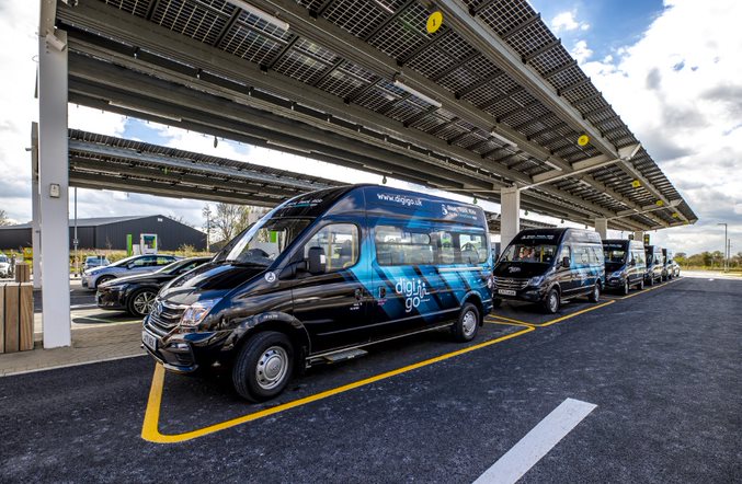 Image of electric mini bus at a charge point