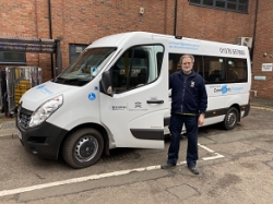 A community transport minibus parked outside the Council's building